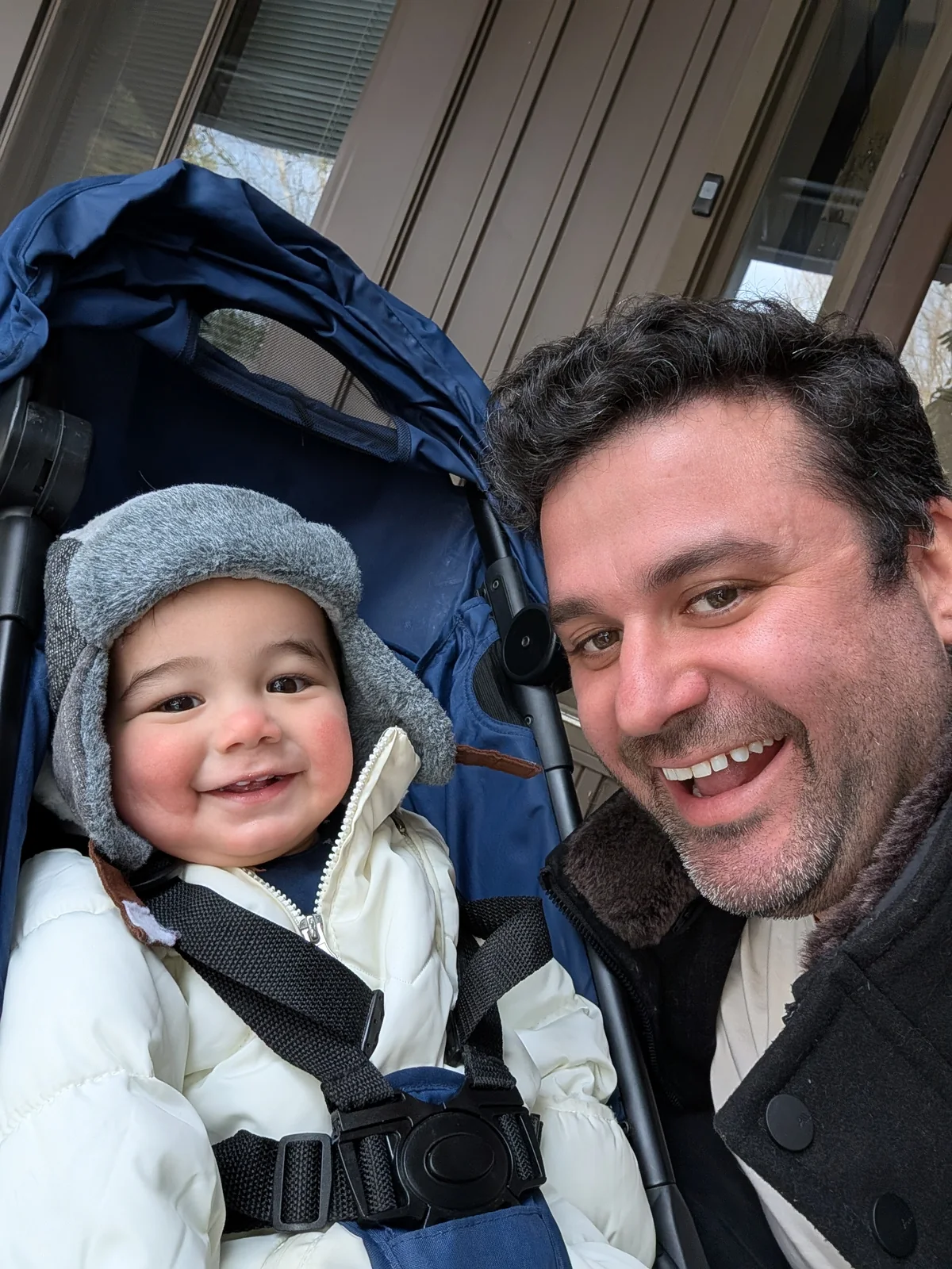 Dan Sussman smiling with his child